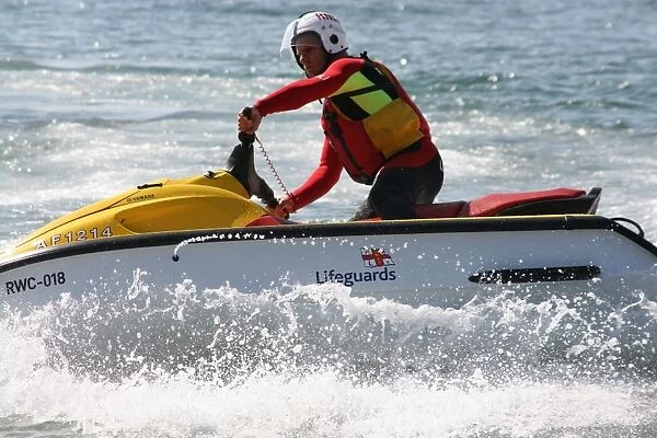 An RNLI lifeguard on a rescue water craft