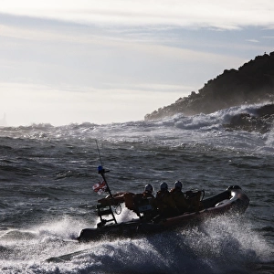 Baltimore Atlantic 75 inshore lifeboat Bessie B-708, waves breaking agasint rocks in the background