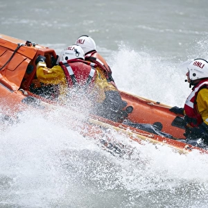 Eastbourne D-class inshore lifeboat Joan and Ted Wiseman 50 D-605. Close up shot, lifeboat moving from right to left, lots of white spray