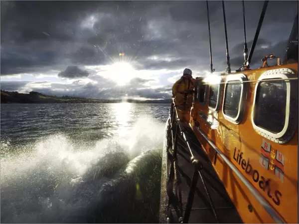 Crew member on board the Wicklow Tyne class lifeboat Annie Blaker 47-035, lots of water spray