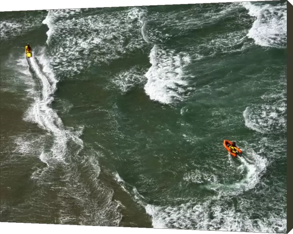 Lifeguards on a rescue watercraft (RWC) and arancia inshore rescue boat shot from Culdrose helicopter in St Ives