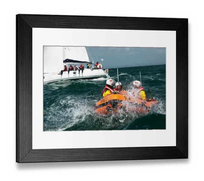 Framed Print : Solent lifeboats provide safety cover during the annual Round the Island Race. Yachts sailing past the Needles. D-class inshore lifeboat pictured Framed Print : Solent lifeboats provide safety cover during the annual Round the Island Race. Yachts sailing past the Needles. D-class inshore lifeboat pictured