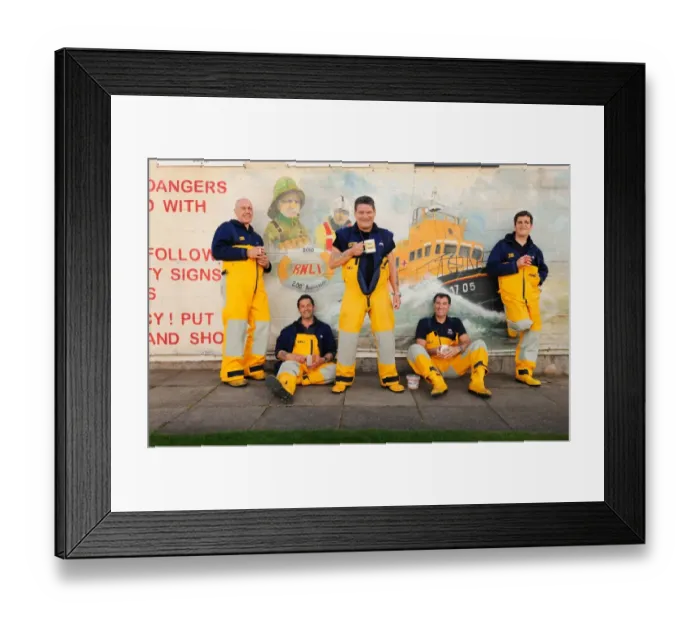 Framed Print : Group shot of Humber crew members lounging against a wall with lifeboat mural on and drinking cups of tea Framed Print : Group shot of Humber crew members lounging against a wall with lifeboat mural on and drinking cups of tea