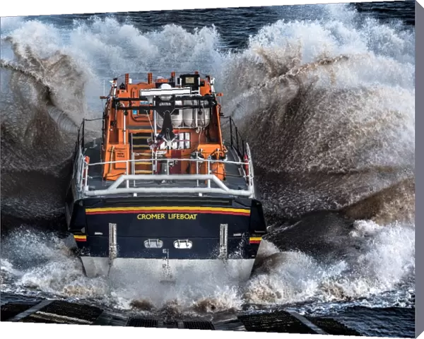 Cromer Tamar class lifeboat Lester 16-07 launching down the slipway, lots of white spray