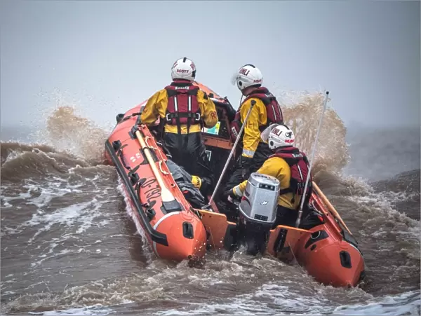 Skegness D-class inshore lifeboat Marie Theresa Bertha Barrass D-792 being launched through surf on a training exercise