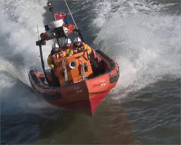 Tower Pier E class lifeboat powering along theThames at high spe