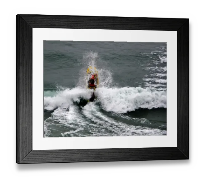 Framed Print : An RNLI lifeguard on a rescue water craft at Perranporth Framed Print : An RNLI lifeguard on a rescue water craft at Perranporth