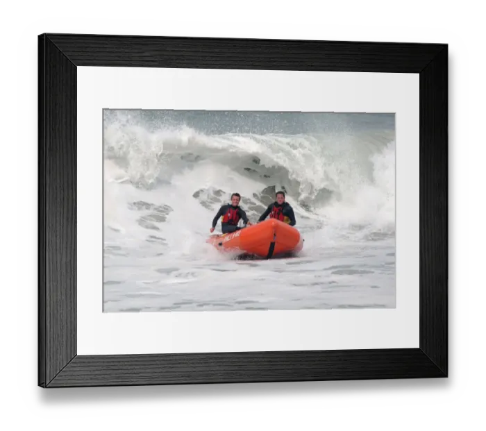 Framed Print : Two lifeguards on an arancia IRB in surf at St Agnes Framed Print : Two lifeguards on an arancia IRB in surf at St Agnes