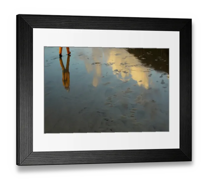 Framed Print : Artistic shot of a crew member walking across wet sand at Barra Framed Print : Artistic shot of a crew member walking across wet sand at Barra