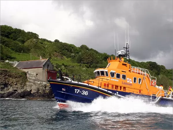 Penlee Severn Class Lifeboat 17-36 Ivan Ellen sailing past the old Penlee boathouse at Mousehole