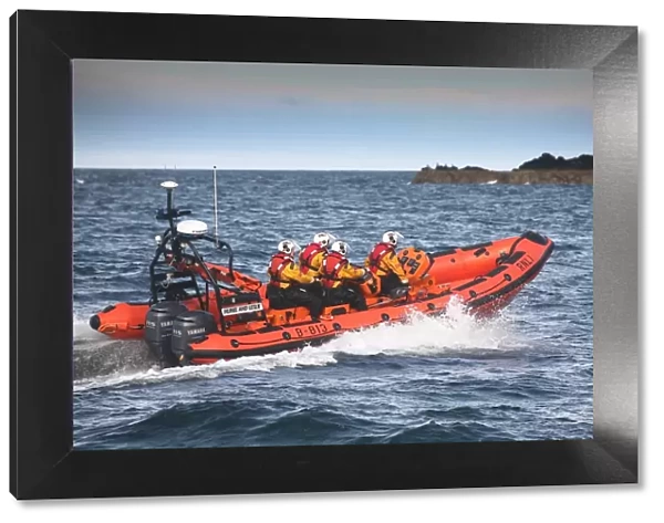 Port Erin Atlantic 85 class inshore lifeboat Muriel and Leslie B-813. Lifeboat heading from left to right, four crew on board