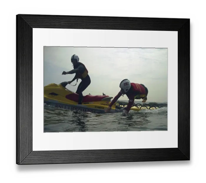 Framed Print : Lifeguard jumping from a rescue watercraft Framed Print : Lifeguard jumping from a rescue watercraft