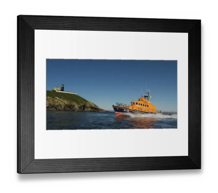 Framed Print : Ballycotton Trent Class lifeboat Austin Lidbury 14-25 moving from right to left, lighthouse in the background. Bright sunny day, blue sky Framed Print : Ballycotton Trent Class lifeboat Austin Lidbury 14-25 moving from right to left, lighthouse in the background. Bright sunny day, blue sky
