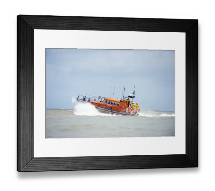 Framed Print : Relief Mersey class lifeboat Mary Margaret 12-28 at Eastbourne. Lifeboat moving from right to left, crew at the stern Framed Print : Relief Mersey class lifeboat Mary Margaret 12-28 at Eastbourne. Lifeboat moving from right to left, crew at the stern