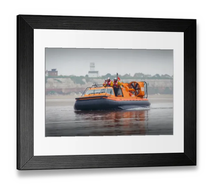 Framed Print : Hunstanton hovercraft The Hunstanton Flyer H-003 heading from right to left over mudflats, four crew on board Framed Print : Hunstanton hovercraft The Hunstanton Flyer H-003 heading from right to left over mudflats, four crew on board