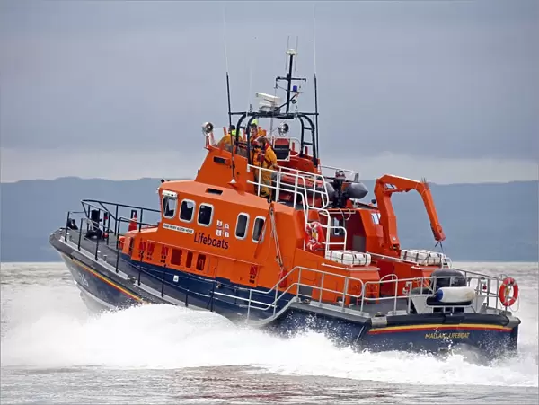 Mallaig severn class lifeboat Henry Alston Hewat 17-26. Lifeboat is moving from right to left, crew at the upper steering position