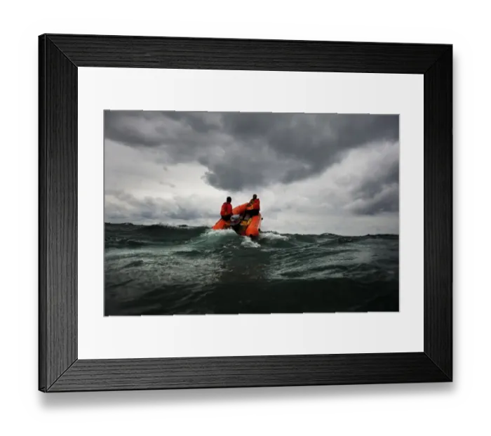 Framed Print : Two lifeguards on an arancia inshore rescue boat at Watergate Bay, Cornwall, headingaway from the camera Framed Print : Two lifeguards on an arancia inshore rescue boat at Watergate Bay, Cornwall, headingaway from the camera