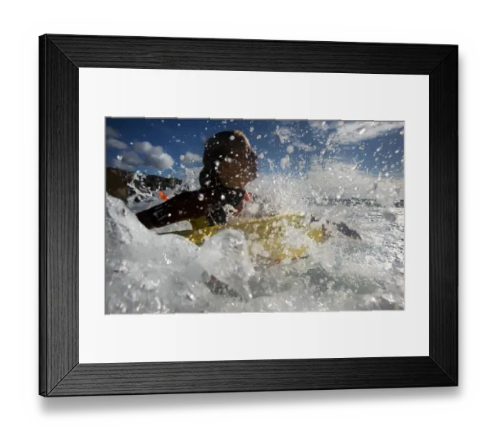 Framed Print : Lifeguard in the surf at Constantine Bay, Cornwall Framed Print : Lifeguard in the surf at Constantine Bay, Cornwall