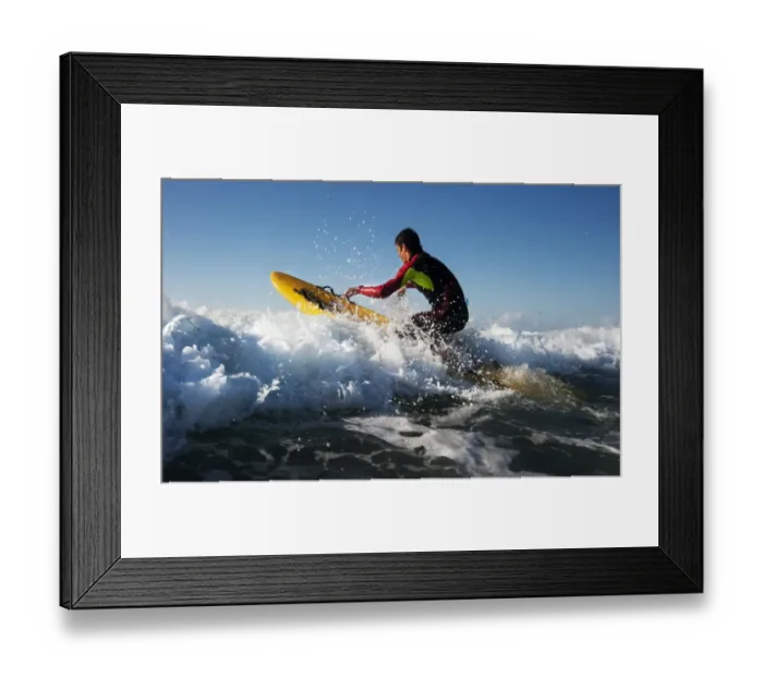 Framed Print : Lifeguard paddling out through surf on a rescue board at Constantine Bay, Cornwall Framed Print : Lifeguard paddling out through surf on a rescue board at Constantine Bay, Cornwall