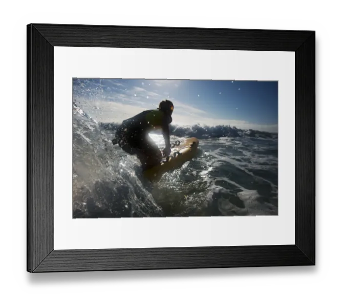Framed Print : Female lifeguard paddling out through surf on a rescue board at Constantine Bay, Cornwall Framed Print : Female lifeguard paddling out through surf on a rescue board at Constantine Bay, Cornwall