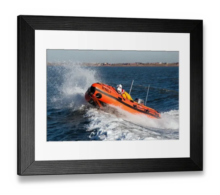 Framed Print : Lytham St Annes D-class inshore lifeboat Sally D-657. Lifeboat moving from right to left, two crew on board Framed Print : Lytham St Annes D-class inshore lifeboat Sally D-657. Lifeboat moving from right to left, two crew on board
