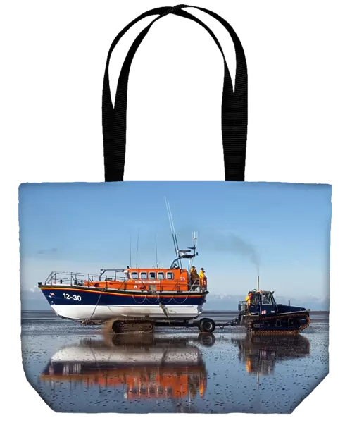 Lytham St Annes Mersey class lifeboat Her Majesty the Queen 12-30 being recovered by tractor on the beach after an exercise