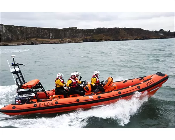 Teignmouth Atlantic 85 inshore lifeboat the Two Annes B-809 moving from left to right, four crew onboard