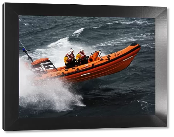 Atlantic 75 inshore lifeboat Dorothy Mary B-728. Lifeboat moving from left to right at speed, lots of white spray