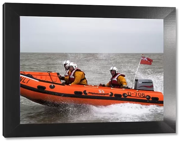 Margate D-class inshore lifeboat Tigger Three D-706. Lifeboat moving from right to left, three crew on board