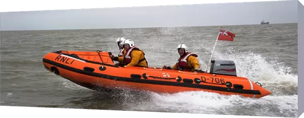 Margate D-class inshore lifeboat Tigger Three D-706. Lifeboat moving from right to left, three crew on board