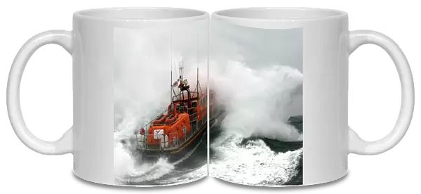 Poole Tyne class lifeboat City of Sheffield 47-023 in rough seas Lifeboat heading through a breaking wave, lots of white spray. Used in Daily Telegraph 18  /  06  /  11