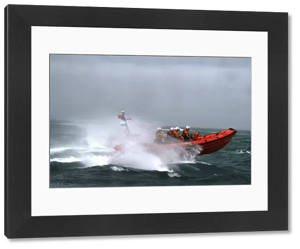 Poole Atlantic 85 class inshore lifeboat Sgt Bob Martin B-826 in rough seas heading from left to right