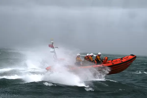 Poole Atlantic 85 class inshore lifeboat Sgt Bob Martin B-826 in rough seas heading from left to right