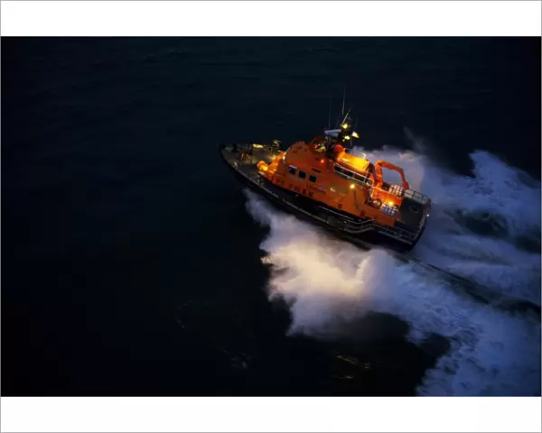 Aran Islands severn class lifeboat David Kirkaldy 17-06. Aerial shot taken from Irish Coastguard helicopter, lifeboat heading from right to left at night