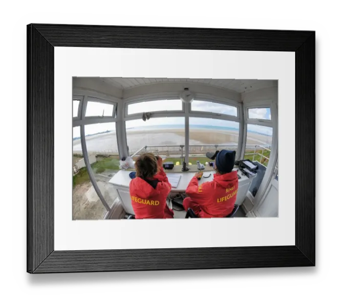 Framed Print : Two lifeguards monitoring the sea at a beach in Jersey from lifeguard hut Framed Print : Two lifeguards monitoring the sea at a beach in Jersey from lifeguard hut