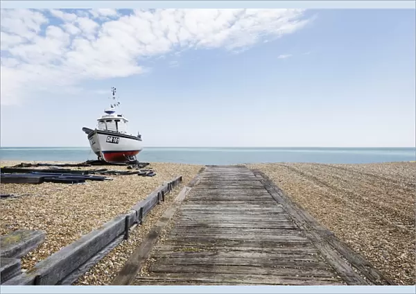 Landscape shot of fishing vessel sat on Walmer beach