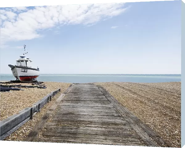 Landscape shot of fishing vessel sat on Walmer beach