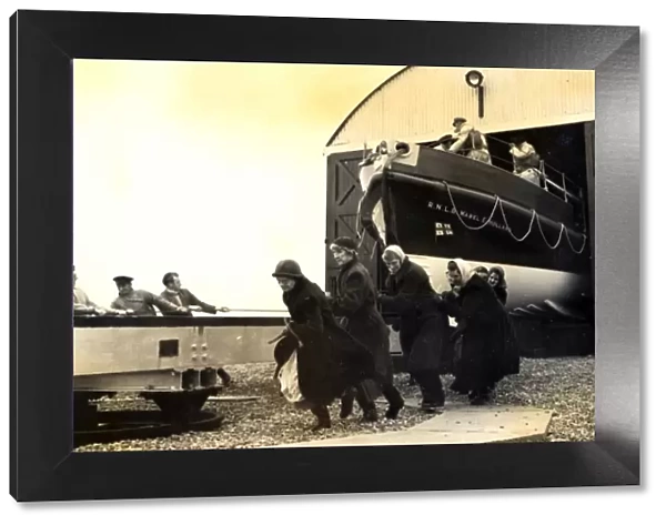 Black and white photo of the lady launchers hauling the Dungeness lifeboat