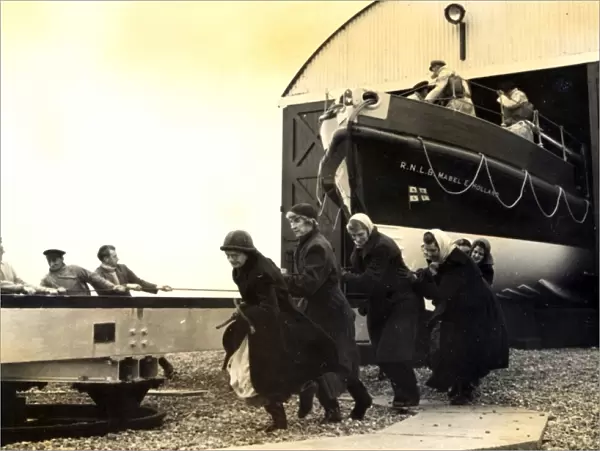 Black and white photo of the lady launchers hauling the Dungeness lifeboat