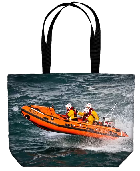 Port Isaac D-class inshore lifeboat Copeland Bell D-707. Silver gallantry medal awardee Damien Bolton on board with Bronze medal awardees Nicola-Jane Bradbury and Matthew Main crewing