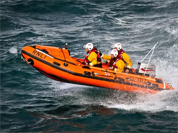 Port Isaac D-class inshore lifeboat Copeland Bell D-707. Silver gallantry medal awardee Damien Bolton on board with Bronze medal awardees Nicola-Jane Bradbury and Matthew Main crewing