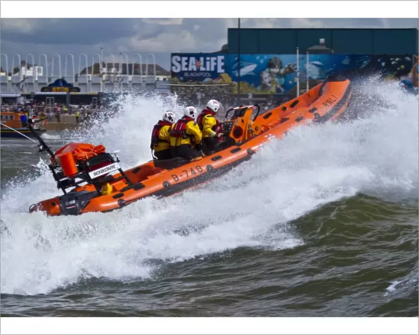 Blackpool Atlantic 75 inshore lifeboat Bickerstaffe heading through a breaking wave. Taken from Fleetwood lifeboat. Shortlisted finallist for Photographer of the Year 2012