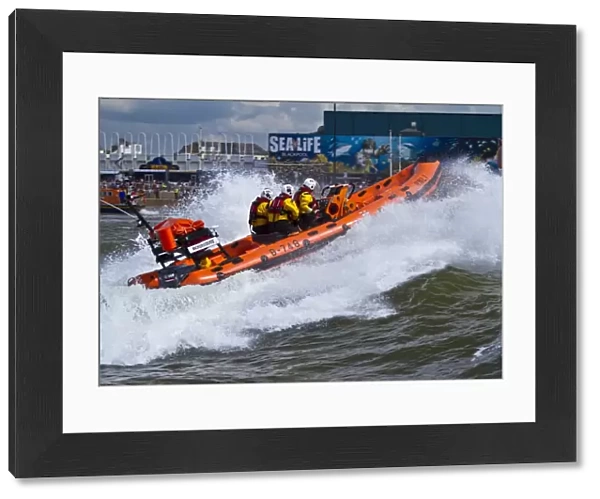 Blackpool Atlantic 75 inshore lifeboat Bickerstaffe heading through a breaking wave. Taken from Fleetwood lifeboat. Shortlisted finallist for Photographer of the Year 2012