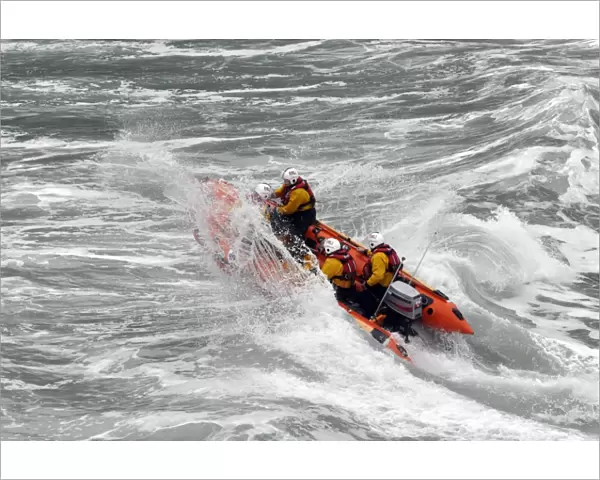 St Agnes d-class inshore lifeboat Blue Peter IV D-641 heading through a breaking wave. Shortlisted finallist for Photographer of the Year 2012