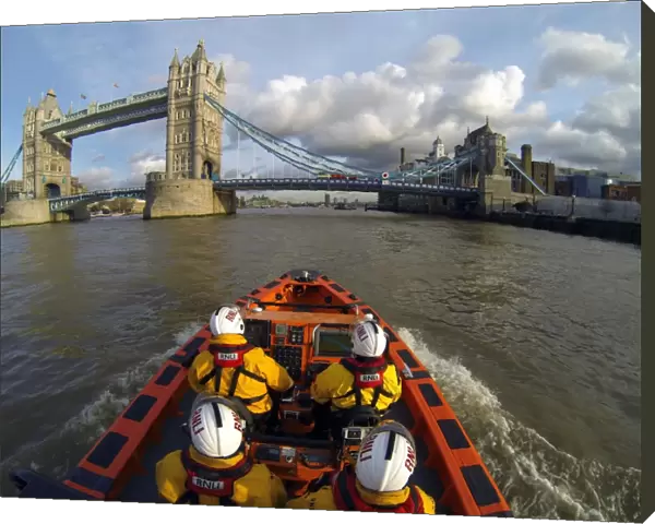 Tower E-class lifeboat Hurley Burly E-07 heading along the Thames towards Tower Bridge