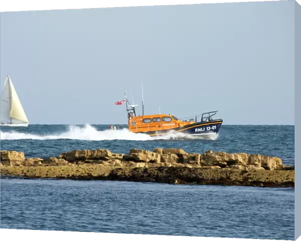 The Shannon class lifeboat RNLB Jock and Annie Slater 13-01 at Swanage to launch the stations fundraising appeal. Lifeboat moving from left to right at speed