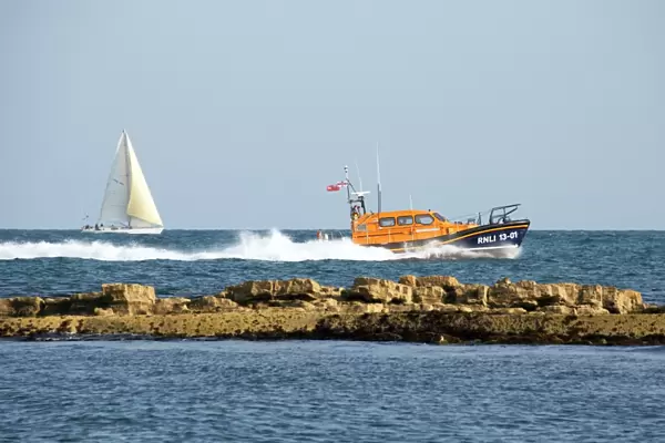 The Shannon class lifeboat RNLB Jock and Annie Slater 13-01 at Swanage to launch the stations fundraising appeal. Lifeboat moving from left to right at speed