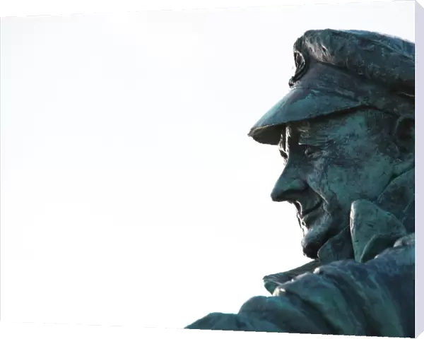 Moelfre. Statue to Dic Evans, double Gold medal holder and coxswain until 1970. The statue was originally sculpted by Ms Sam Holland and unveiled by HRH Prince Charles 23  /  11  /  2004