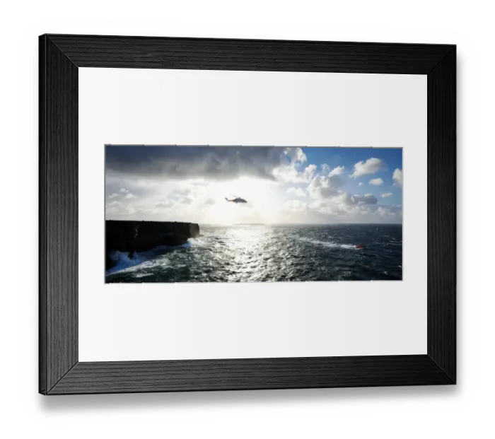 Framed Print : Beyond the dramatic limestone cliffs of the Aran Islands, Irish Coast Guard helicopter Rescue 115 and Severn class David Kirkaldy patrol the heaving Atlantic waters at the entrance to Galway Bay Framed Print : Beyond the dramatic limestone cliffs of the Aran Islands, Irish Coast Guard helicopter Rescue 115 and Severn class David Kirkaldy patrol the heaving Atlantic waters at the entrance to Galway Bay