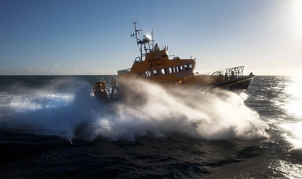 Arklow Trent class lifeboat Ger Tigchelaar 14-19 . Lifeboat moving from left to right at speed, lots of white spray